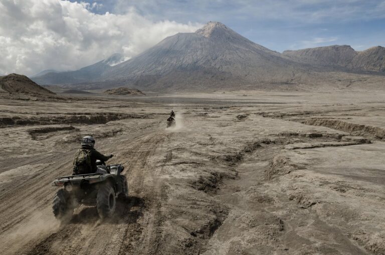A wide lahar plain with an ATV trail cutting across it